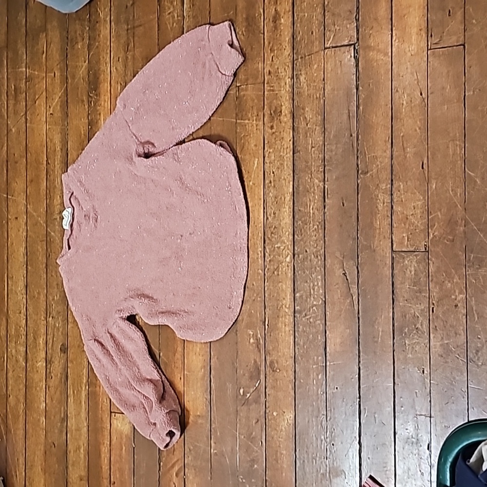Comfortable, pink sweater. Me a joy.